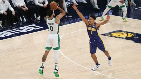 Jayson Tatum shooting a 3 over Malcolm Brogdon. (Getty)