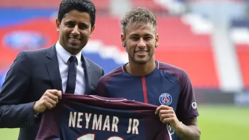 Neymar poses with his new jersey next to Paris Saint-Germain President Nasser Al-Khelaifi after a press conference on August 4, 2017 in Paris, France (Getty Images).
