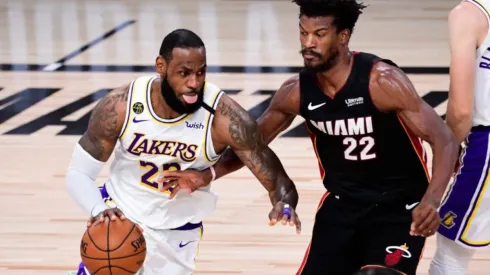 LeBron James of Los Angeles Lakers (left) tries to pass drible Jimmy Butler of the Miami Heat during the 2020 NBA Finals
