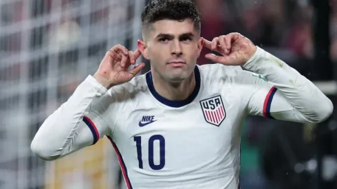 Christian Pulisic celebrates after scoring against Mexico.
