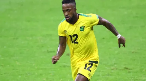 Junior Flemmings of Jamaica drives the ball.