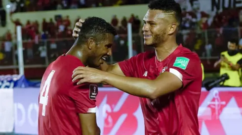 Rolando Blackburn of Panama celebrates with teammate Fidel Escobar.
