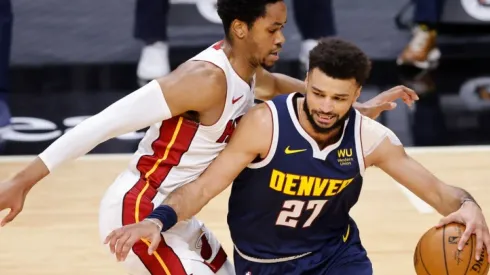 KZ Okpala of Miami Heat (left) tries to block Jamal Murray of Denver Nuggets
