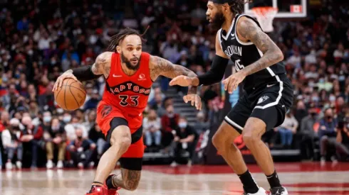 Gary Trent Jr of Raptors (left) tries to drible pass DeAndre Bembry of Nets
