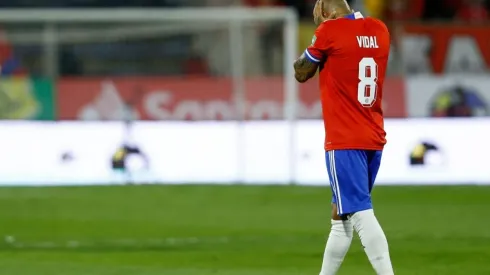 Arturo Vidal of Chile walks off the field after being sent off during a match between Chile and Ecuador