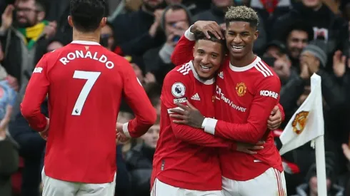 Manchester United players celebrate after scoring a goal
