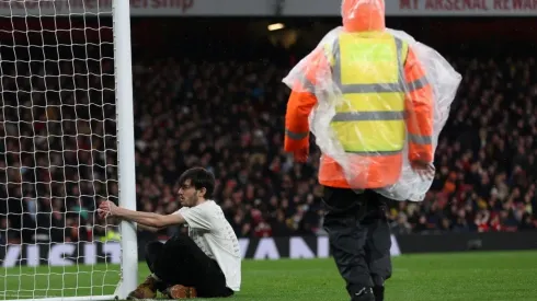 Man holds on to the post
