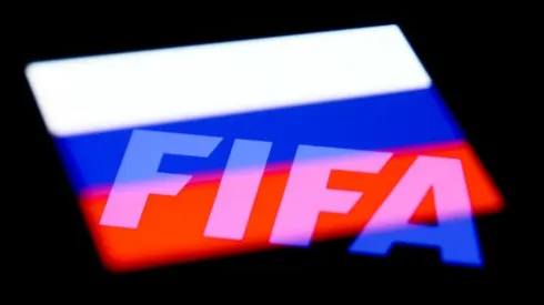 FIFA logo displayed on a phone screen and Russian flag displayed