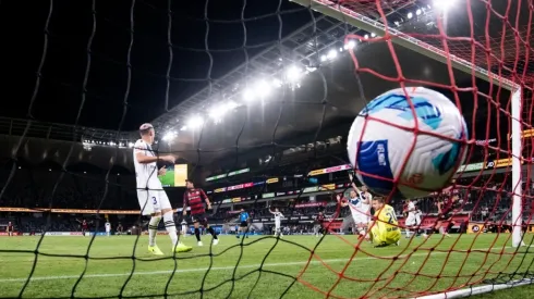 : Ivan Kelava of Melbourne Victory watches the ball go past him into the goal during the A-League soccer

