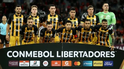 Players of The Strongest pose for photographers