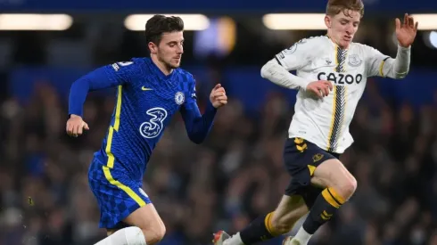 Mason Mount of Chelsea is challenged by Anthony Gordon of Everton
