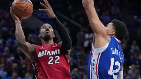 Jimmy Butler of the Miami Heat shoots the ball against Tobias Harris of the Philadelphia 76ers
