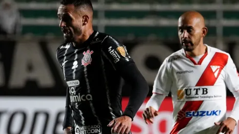 Renato Augusto of Corinthians (R) fights for the ball with Marco Riquelme of Always Ready
