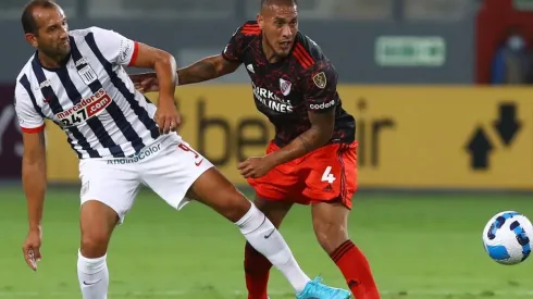 Jonatan Maidana of River Plate fights for the ball with Hernan Barcos of Alianza Lima
