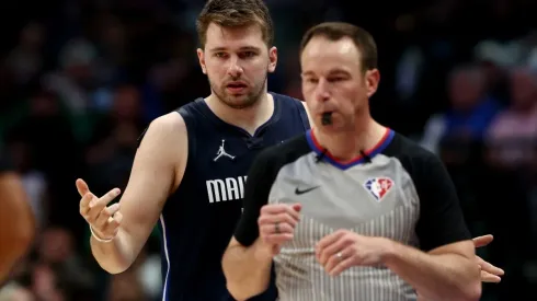 Luka Doncic of the Dallas Mavericks argues with referee Josh Tiven
