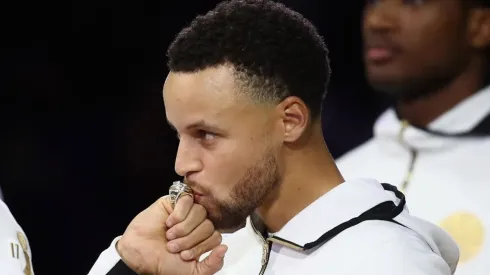 Stephen Curry of the Golden State Warriors kisses his NBA Championship ring