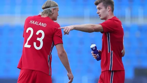 Erling Haaland of Norway speaks with team mate Patrick Berg
