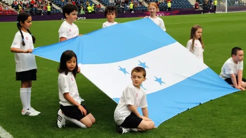 Children display the national flag of Honduras