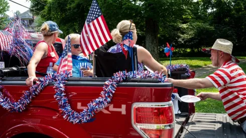 Young fan holding american flag