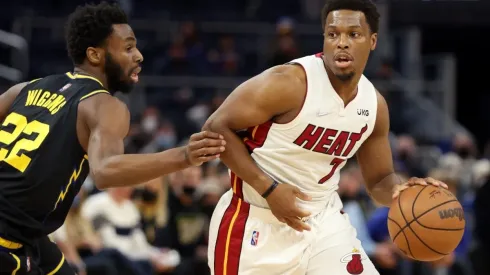 Kyle Lowry of the Miami Heat is guarded by Andrew Wiggins of the Golden State Warriors
