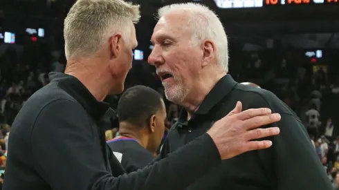 Head coach of the Golden State Warriors Steve Kerr greets San Antonio head coach Gregg Popvich
