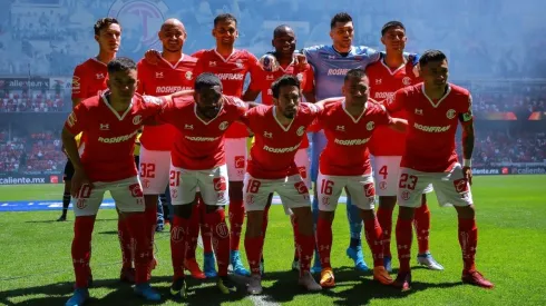 Players of Toluca poses for a photo