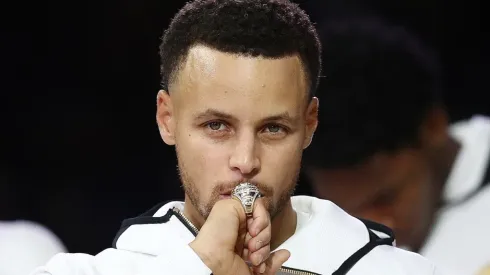 Stephen Curry of the Golden State Warriors kisses at his NBA Championship ring
