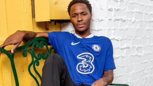Raheem Sterling poses with the Chelsea jersey.