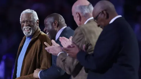 Former NBA players Bill Russell (L) and Earvin "Magic" Johnson Jr. react as they are honored during the 2017 NBA All-Star Game
