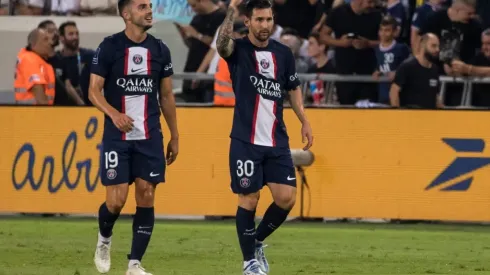 Paris Saint-Germain's Lionel Messi and Idrissa Guete celebrate after scoring
