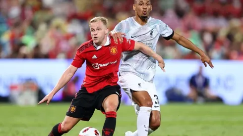 Donny van de Beek of Manchester United competes for the ball against Fabinho of Liverpool
