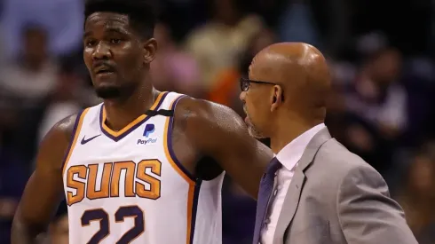 DeAndre Ayton of the Phoenix Suns stands with head coach Monty Williams
