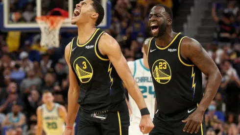 Jordan Poole (left) and Draymond Green.
