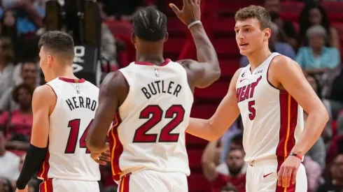 Nikola Jovic of the Miami Heat is congratulated by Jimmy Butler
