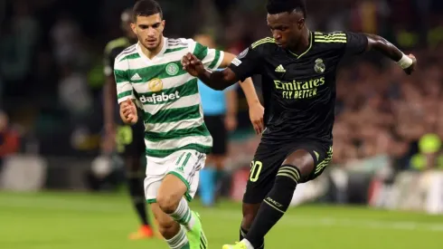 Vinicius Junior of Real Madrid evades Liel Abada of Celtic