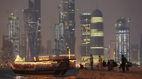 People fish along the waterfront along the Persian Gulf in Doha, Qatar.
