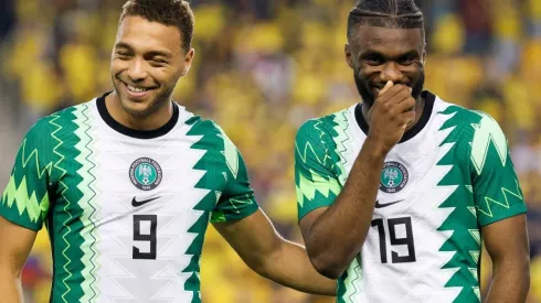 Cyriel Dessers (L) and Terem Moffi (R) of Nigeria laugh before a game against Ecuador
