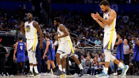 Draymond Green, Stephen Curry, and Andrew Wiggins
