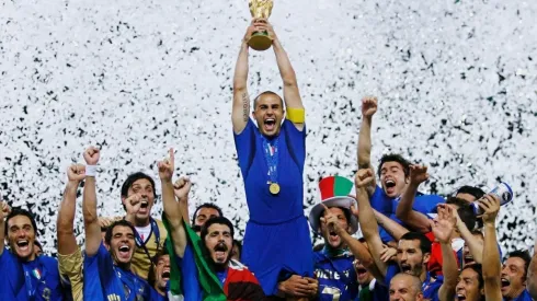 The Italian players celebrate as Fabio Cannavaro of Italy lifts the World Cup trophy
