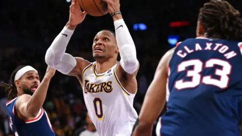 Russell Westbrook of the Los Angeles Lakers is defended by Patty Mills and Claxton of the Brooklyn Nets
