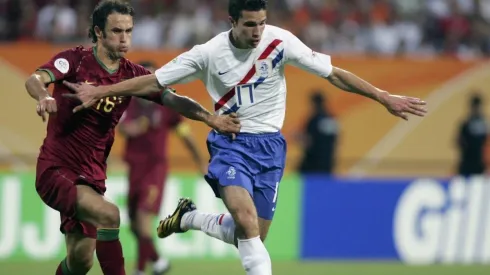 Robin Van Persie (R) of the Netherlands holds off Ricardo Carvalho of Portugal during the FIFA World Cup Germany 2006
