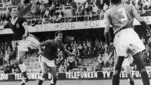 Welsh centre-forward John Charles (left) makes an attack on the Mexican goal during the Wales-Mexico World Cup match in Stockholm