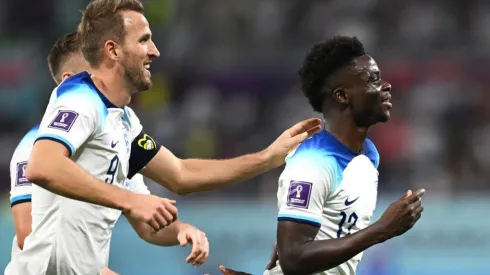 Bukayo Saka (R) of England celebrates scoring his team's fourth goal
