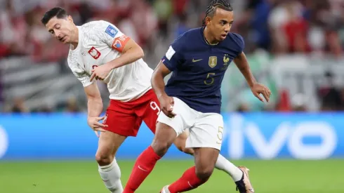 Jules Kounde of France battles for possession
