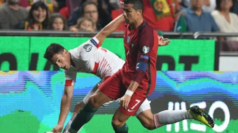 Cristiano Ronaldo of Portugal competes for the ball with Fabian Schar of Switzerland during the FIFA 2018 World Cup Qualifier
