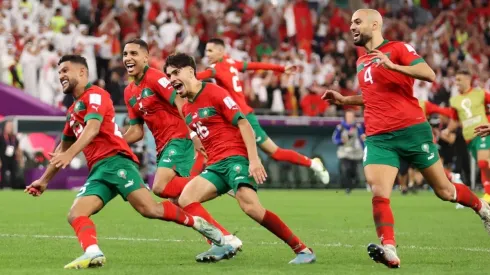 Morocco players celebrate after the team's victory in the penalty shoot out
