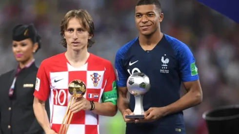 Luka Modric of Croatia and Kylian Mbappe of France pose respectively with their the adidas Golden Ball and with the FIFA Young Player award
