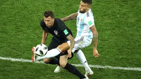 Mario Mandzukic of Croatia is tackled by Nicolas Otamendi of Argentina
