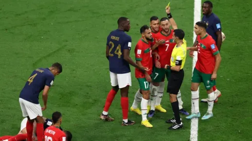 Sofiane Boufal of Morocco is shown a yellow card by Referee Cesar Arturo Ramos
