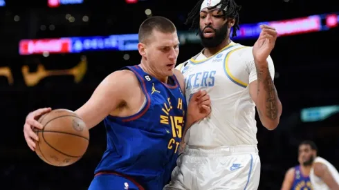 Nikola Jokic of the Denver Nuggets pushes against Anthony Davis of the Los Angeles Lakers
